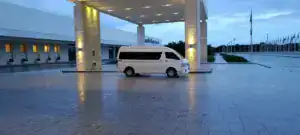 Luxury hotel entrance with white van in Riviera Maya, Mexico.