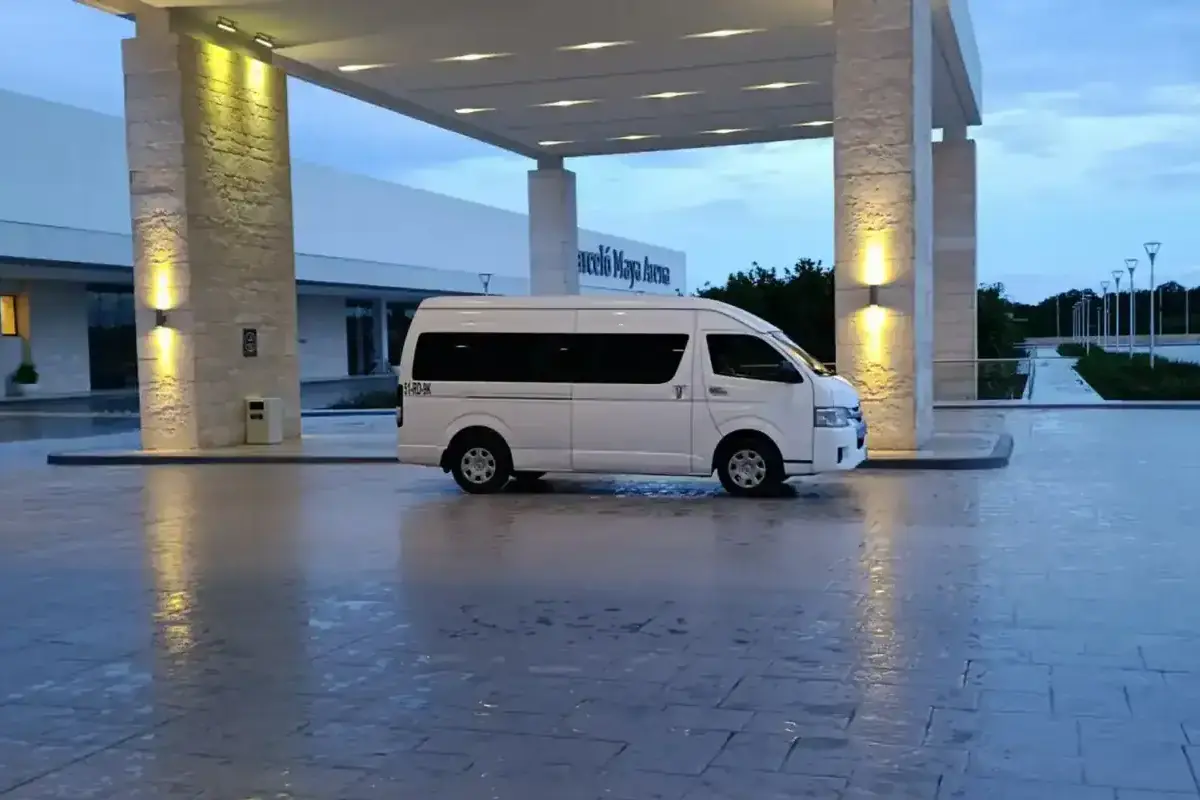 Luxury hotel entrance with white van in Riviera Maya, Mexico.