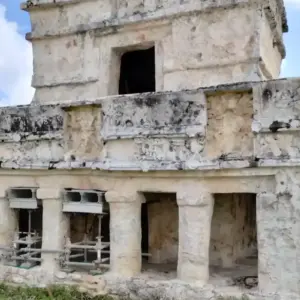 Ancient Mayan ruin at Tulum, Mexico, with stone architecture and historical significance.