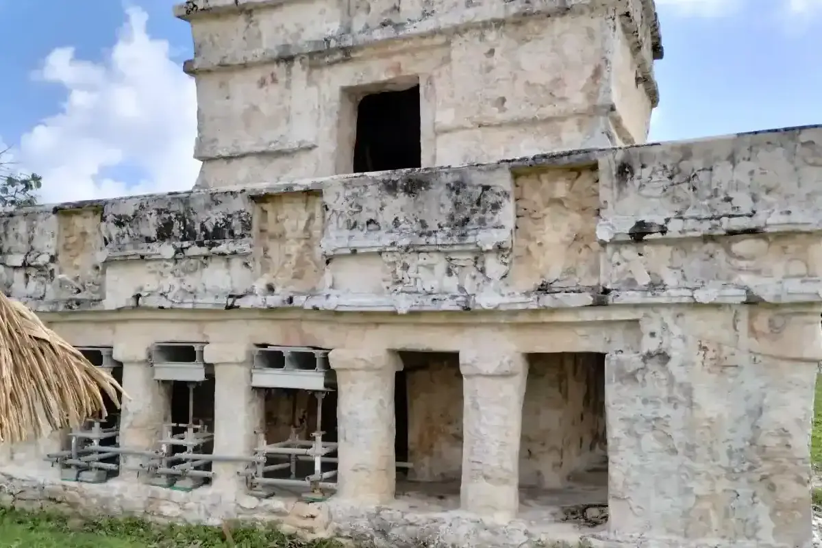 Ancient Mayan ruin at Tulum, Mexico, with stone architecture and historical significance.